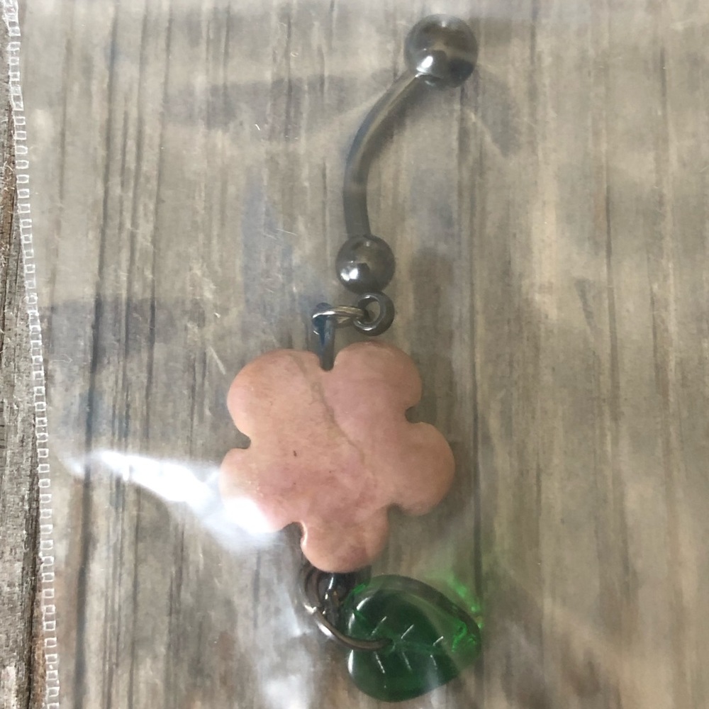 Flower with hanging leaf belly ring.